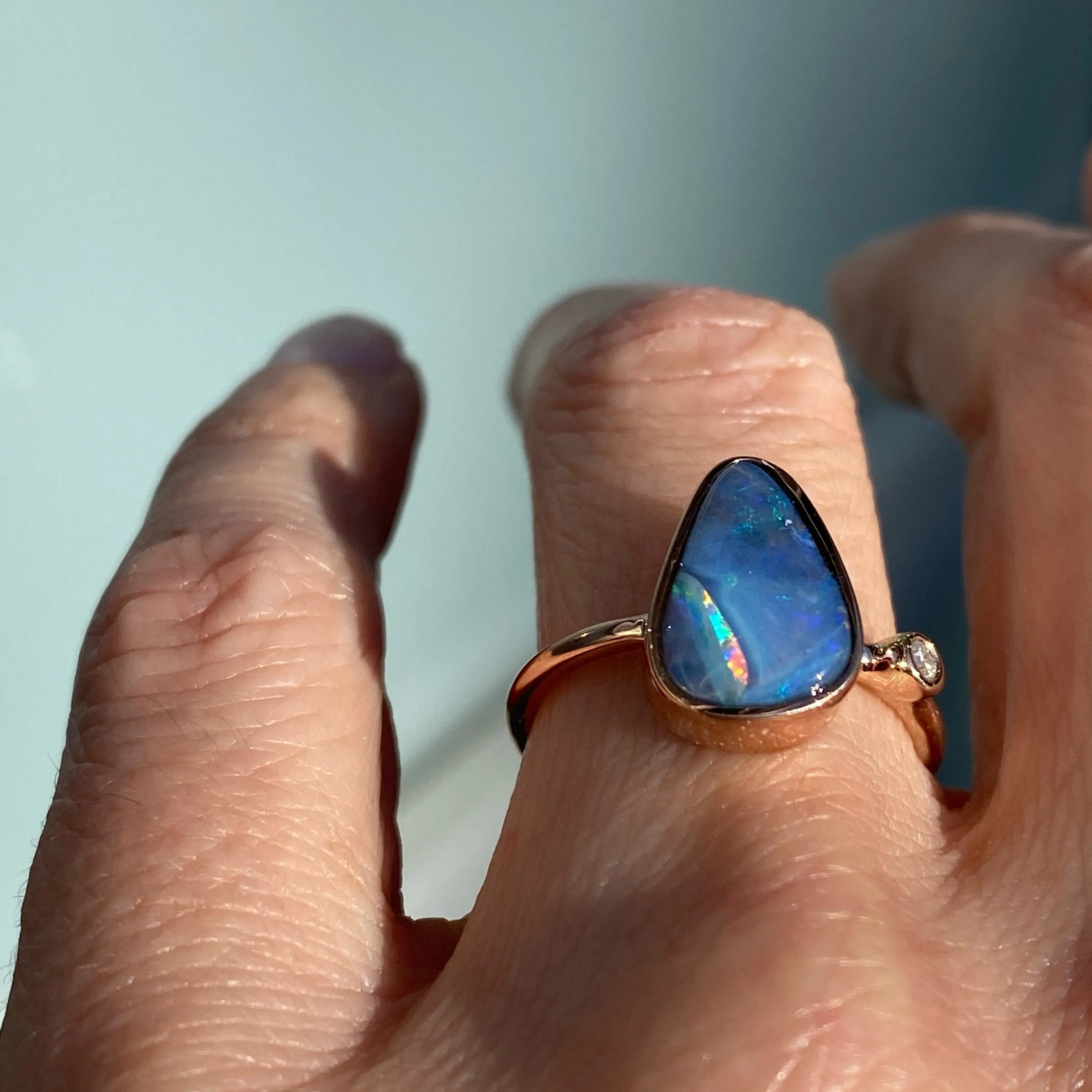 Rainbow River Dali Blue Boulder Opal and Diamond Rose Gold Ring